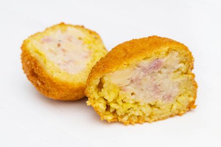 Sicilian Arancino or Arancina. A typical Sicilian street food. Made with rise, ham, meat and cheese.の写真素材