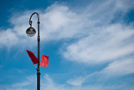 The lighting pole with two red flags on Victory Dayの写真素材