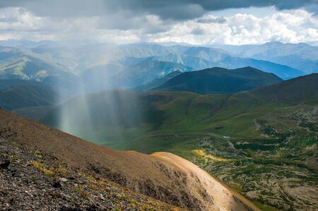 Sunbeams over the Abudelauri lakes in Khevsureti, Georgiaの写真素材