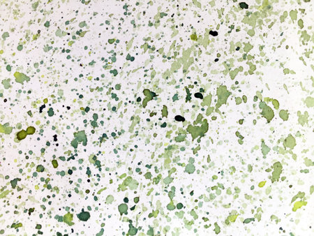 Watercolor small splashes of different shades of green on a white backgroundの写真素材