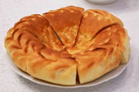 Uzbek bread on plate  flat cake の写真素材