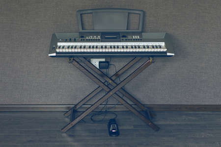 Synthesizer keyboard on stand with pedal
