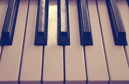 Vintage keys of piano (old-style shot)の写真素材