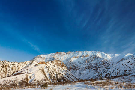 Picturesque mountain alps partially covered by snow, late fallの写真素材