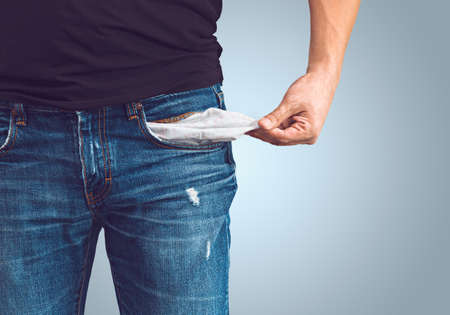 Poor man in jeans with empty pocket Poor man in jeans with empty pocket