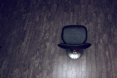 Vacant black bar chair top view on wooden surface with empty spaceの写真素材