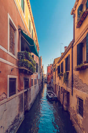 View of canal in Venice and street with beautiful colorful old housesの写真素材
