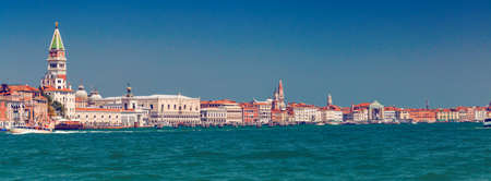 Panorama of Grand canal coast line with a lot of colorful houses, Doge palace and San Marko square...