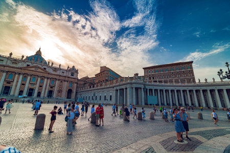 VATICAN, Rome, Italy - August 09, 2017: St Peter's Basilica with tourists at sunset