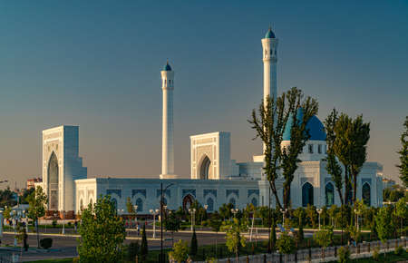 A big beautiful Mosque (Islamic temple) at sunrise over blue skyの写真素材