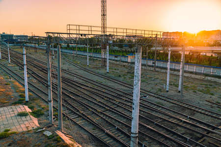A lot of railway tracks on sunset