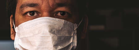 Closeup of man in mask, concept of viral infection. Theme of corona-virus epidemic.