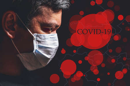 Profile of man in mask against map, concept of viral infection. Theme of corona-virus epidemic.の写真素材