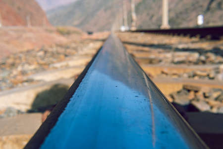 Rail closeup. Low angle perspective view of train rails