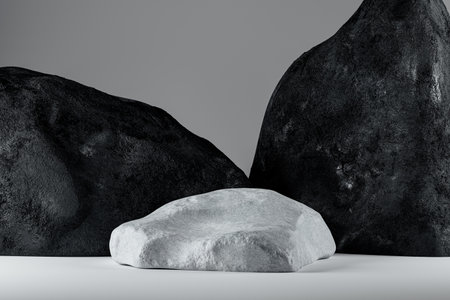 3d presentation pedestal made of natural white rock over black rocks background. 3d rendering of mockup of presentation podium for display or advertising purposesの写真素材