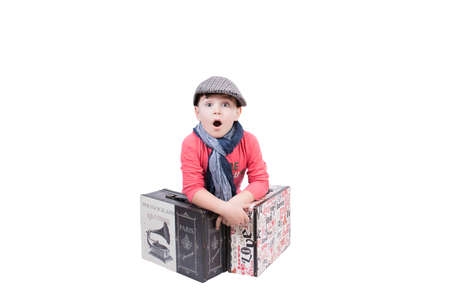 Boy am amazed with travel suitcaseの写真素材