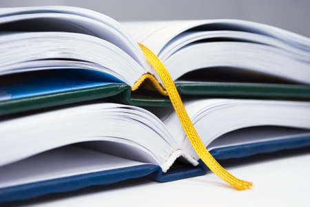 Two multicolored diary with yellow bookmark