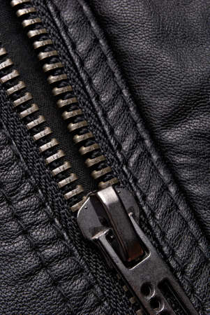 Close-up zipper on black leather jacketの写真素材