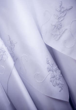 Fragment of a wedding dress beadwork and a silk tapeの写真素材