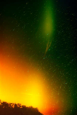 Colorful green and yellow star sky with trails