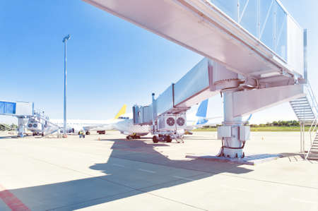 Airplane ready for boarding in a airport hub.の写真素材