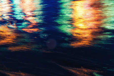 City lights reflections. Colorful glare on the waterの写真素材
