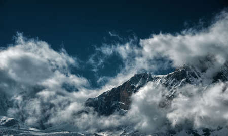 Dawn in the mountains, when a lot of clouds, glaciers