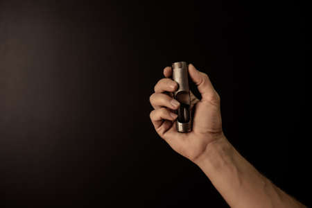 Hands holding leather craft object with tool using for manufactureの写真素材