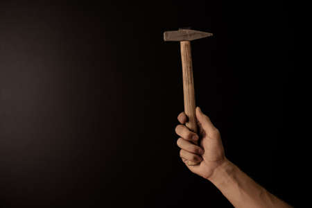 Hands holding leather craft object with tool using for manufactureの写真素材