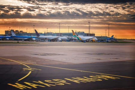 Landing light. Directional sign markings on the tarmac of runway at a commercial airportの写真素材