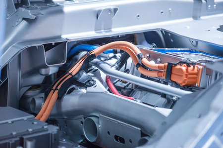Chassis of the electric car with powertrain and power connections closeup. Blue toned.の写真素材