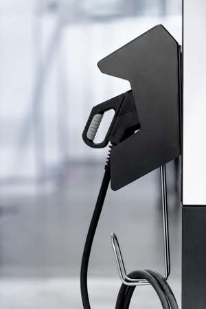 Electric vehicle charging station with plug of power cable supply for Ev car.の写真素材