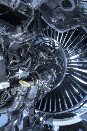 Turbine Engine. Aviation Technologies. Aircraft jet engine detail during maintenance. Blue tonedの写真素材