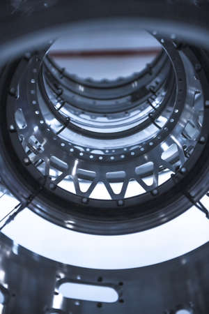 Turbine Engine. Aviation Technologies. Aircraft jet engine detail during maintenance. Blue toned.の写真素材
