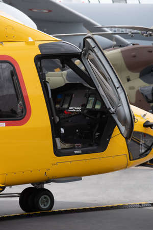 Offshore transport helicopter flight seat for passengers. Transport helicopter parking. Waiting for passengers boarding.の写真素材