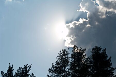 The big cloud approaches on the sun, closing lightの写真素材