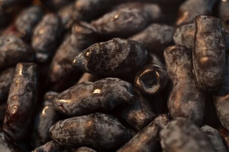 Ripe berries of a honeysuckle are scattered on an equal surface, a close upの写真素材