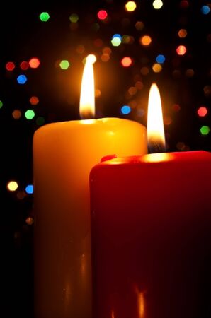 Two burning candles on a dark abstract backgroundの写真素材