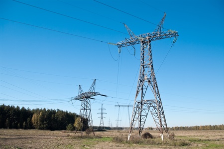 High-voltage electric main on a background of the clear dark blue skyの写真素材