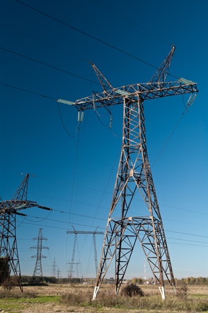 High-voltage electric main on a background of the clear dark blue skyの写真素材