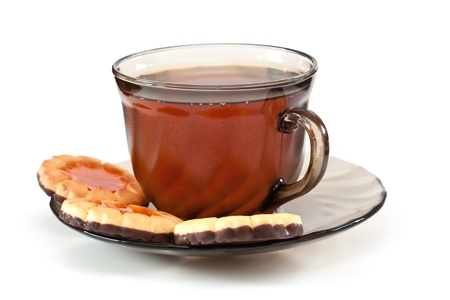 Tea in a glass cup, on a dish cookies の写真素材