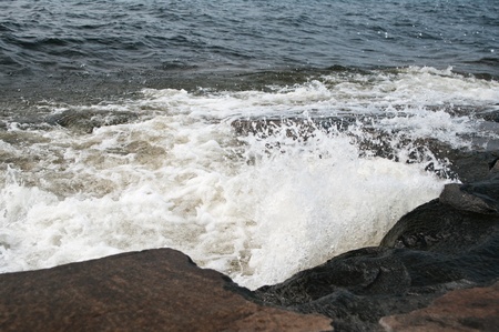 Wave incident on a stone beachの写真素材