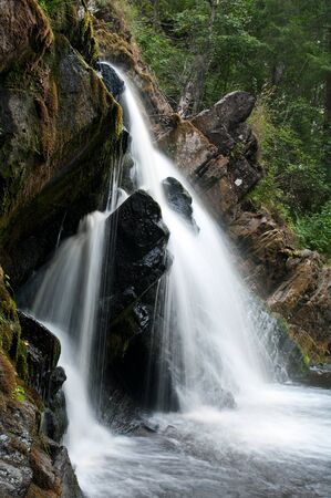 Water landscape with a waterfall, side viewの写真素材