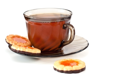 Tea in a glass cup, on a dish cookiesの写真素材