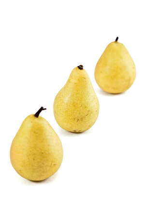 still life of three yellow pears, diagonal scheme の写真素材