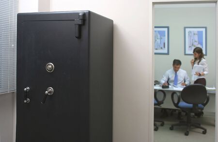 Safety box in an office with an employee and his secretary