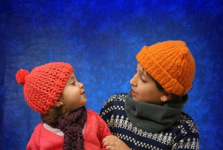 Brother and sister having fun in winter outfit. Look at my gallery for more winter imagesの写真素材
