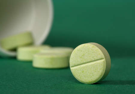 Medicine pills spilling from a prescription medicine bottle の写真素材