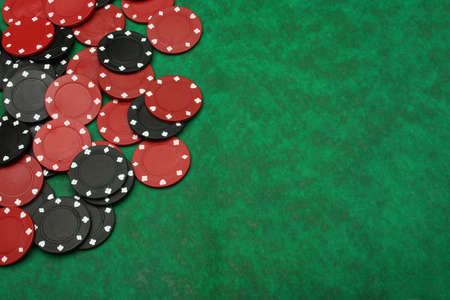 Gambling chips over green felt with copy space. I´ve got more poker imagesの写真素材