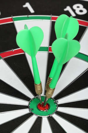 Dartboard bull´s eye. Three darts on center